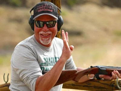 A shooter on a Ruggs Ranch clay course